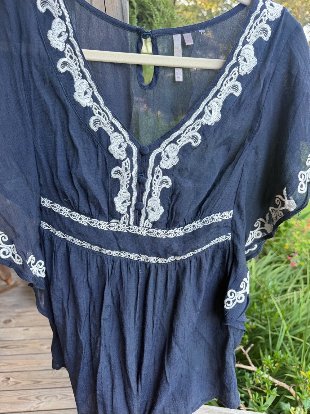 acacia navy blue top with cream embroidery